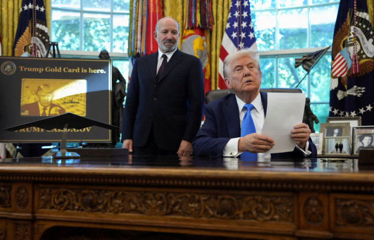U.S. President Donald Trump signs executive orders in the Oval Office at the White House in Washington